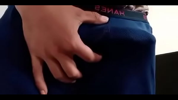 Flashing big dick through boxers in public restroom