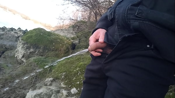 Cute Asian gay twink pulls out his cock and pees outside in this piss porn video compilation.
