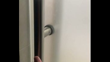 2 boys having fun at the pool public toilets’ urinal